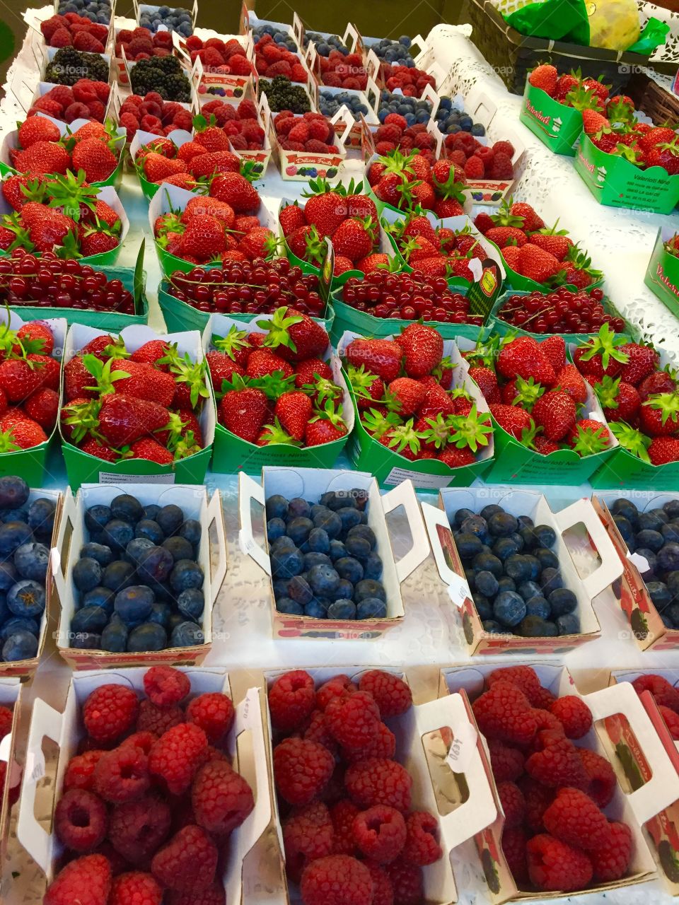 Variety of berries on market stall