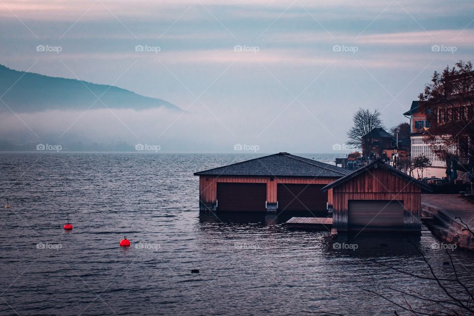 Calm lake and boathouse