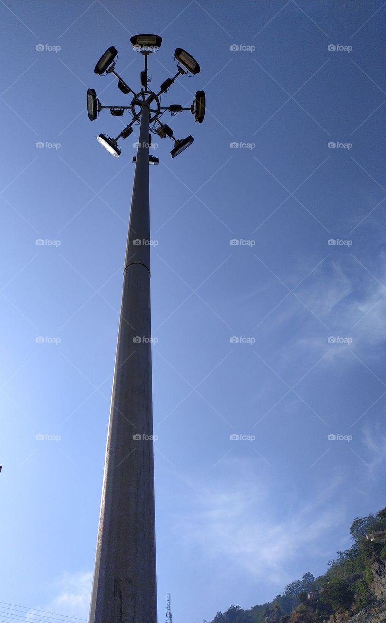 The high mast octagonal light tower standing tall into the sky