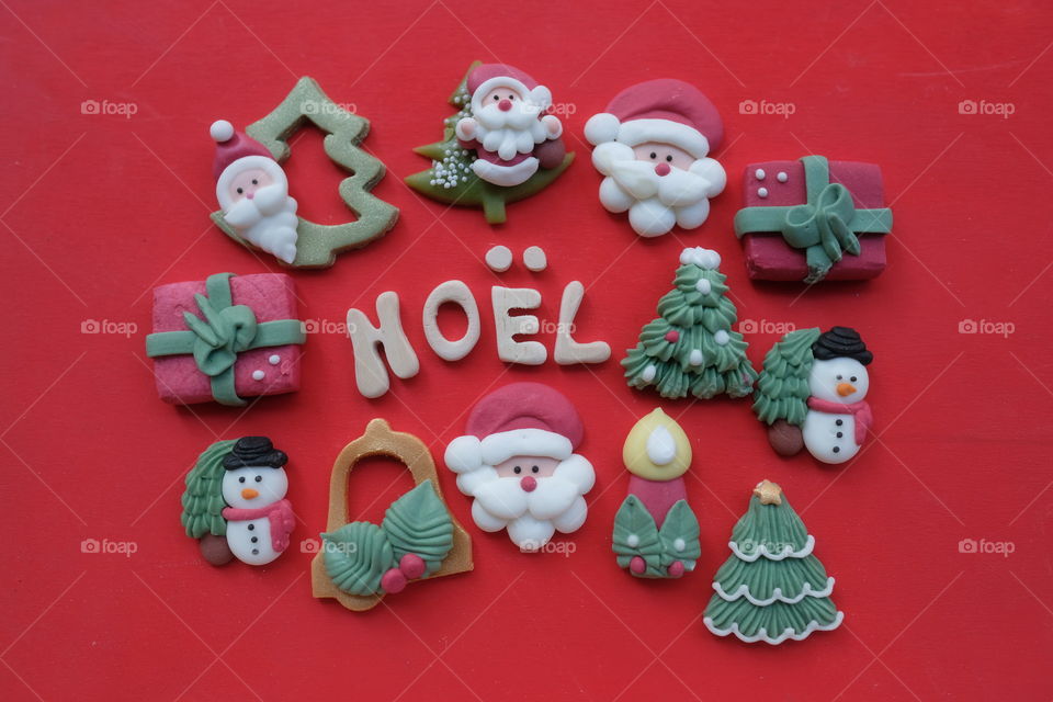 Noel, Merry Christmas in french language with marzipan Christmas symbols