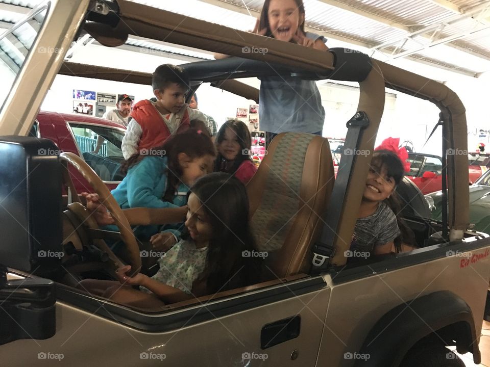 Kids having fun on jeep