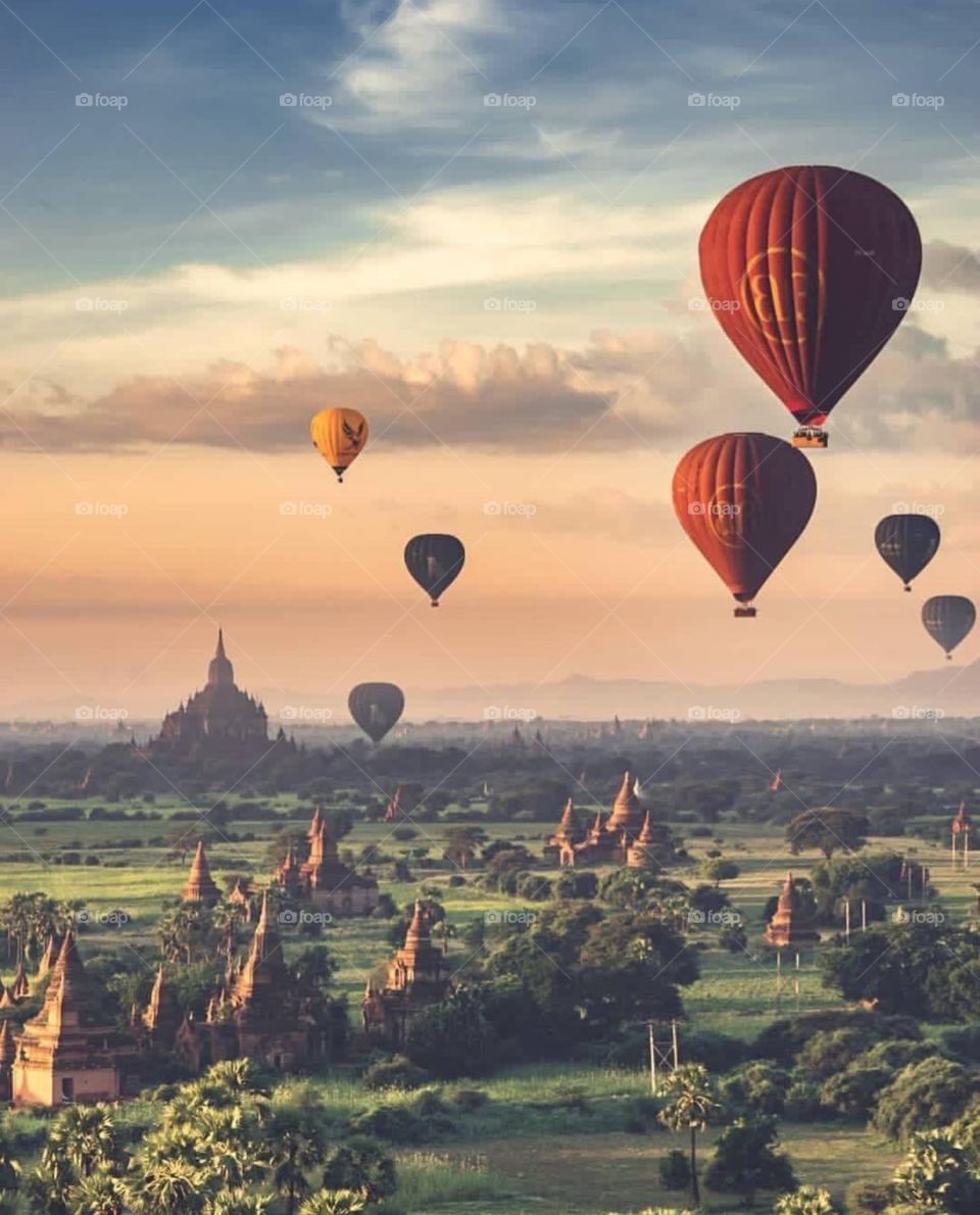 An Ancient city of Bagan,Myanmar 
Balloons fly in the beautiful sunset
