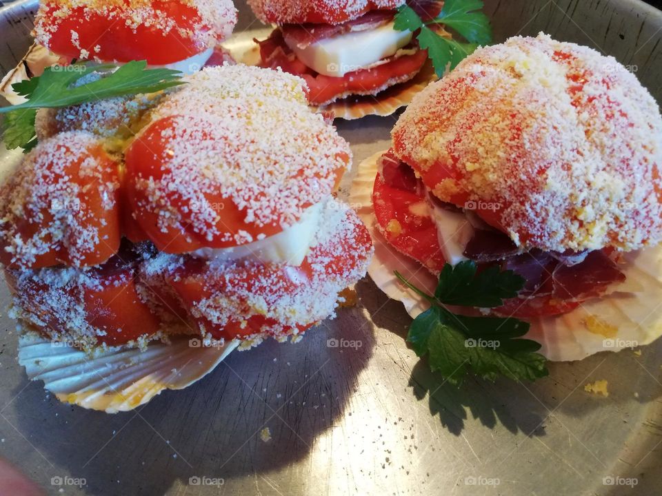 stuffed tomato with mozzarella and ground beef and baked in the oven