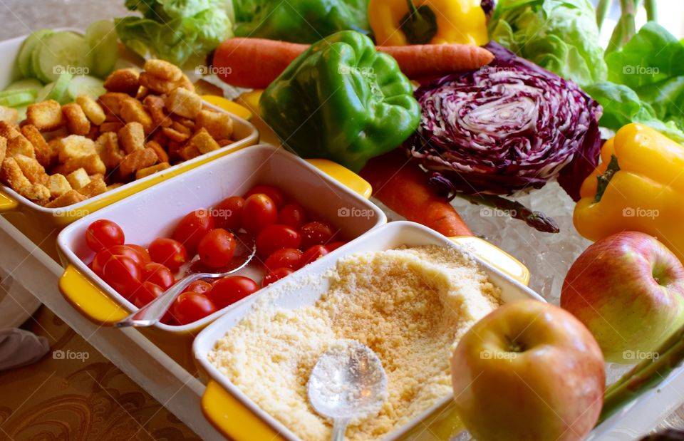 Fresh, organic variety of vegetables and other toppings for a Salad 