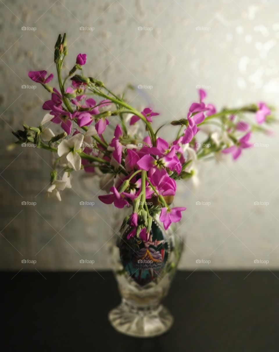 A bouquet of wildflowers in a beautiful vase