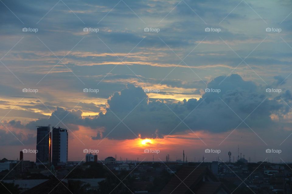 Sunset, looking over the city with a view of the skyscrapers and golden sky