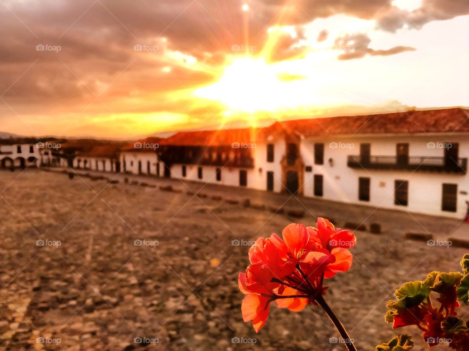 Beautiful sunset with flowers in the main square of Villa de Leyva Boyacá Colombia