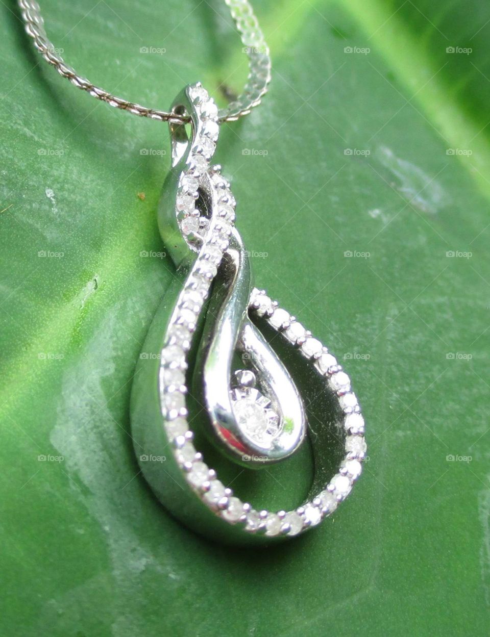 Twisted teardrop silver and diamond pendant