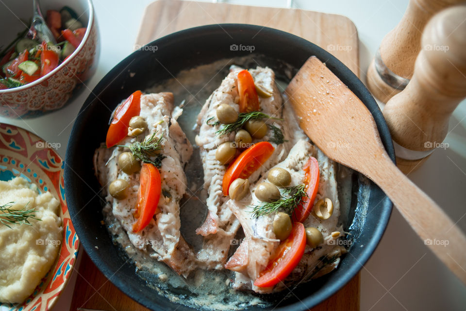 Dish with Sea bass fried with vegetables 