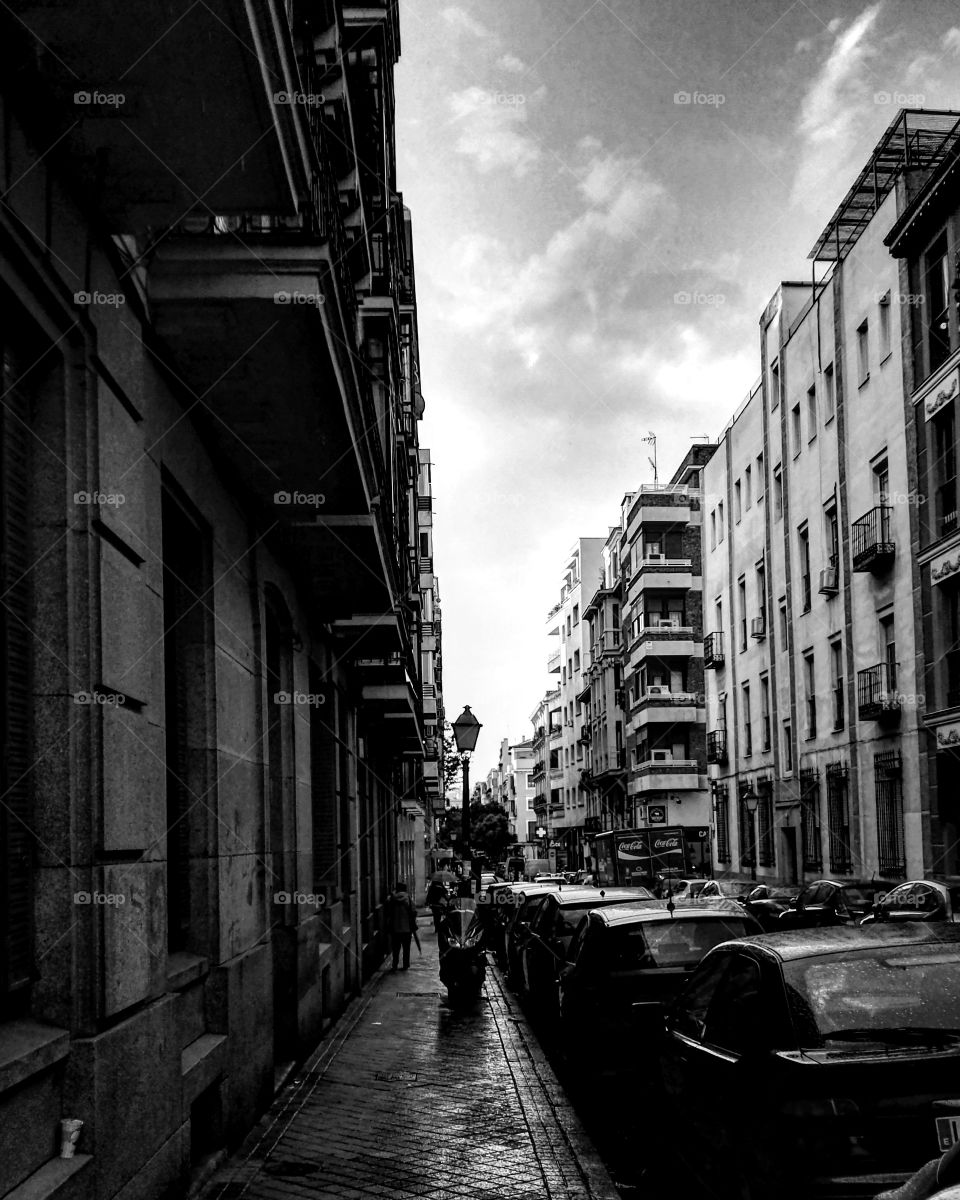 Melancholy of the city life, this picture was taken in Madrid. Resembles the sweet and sour beauty of the streets after a rainy day. Full of life, yet so dark.