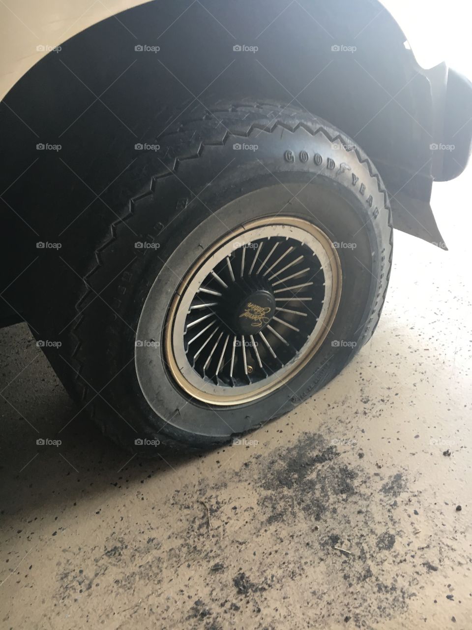 Flat golf cart tire, very old and crumbly