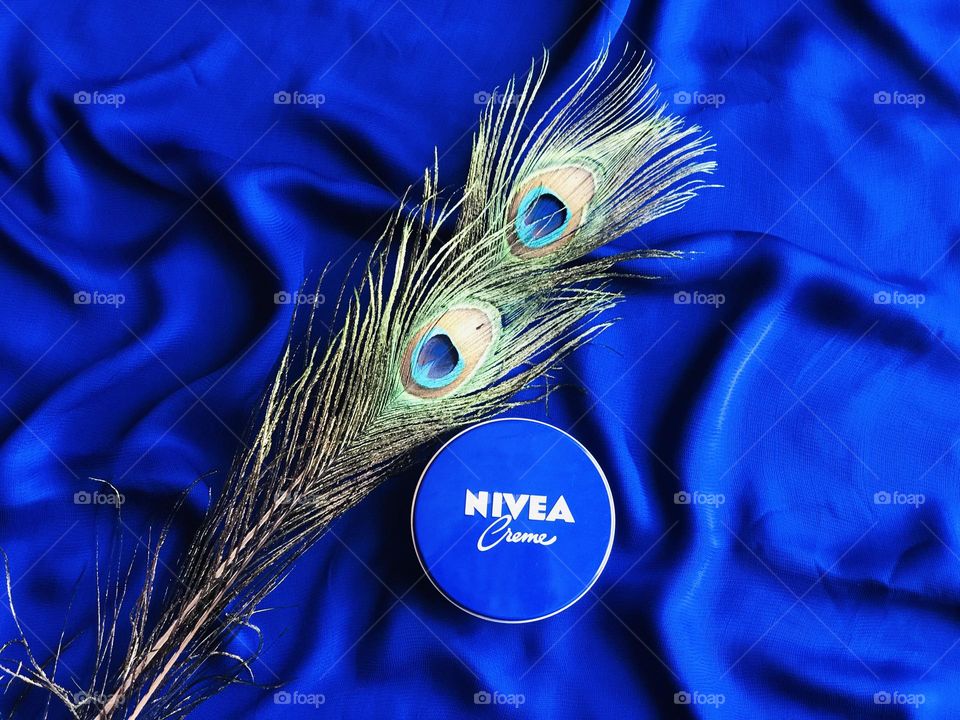 Nivea cream with peacock feathers.