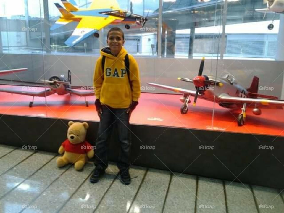 My  son, Winnie the Pooh  at the  airport.
