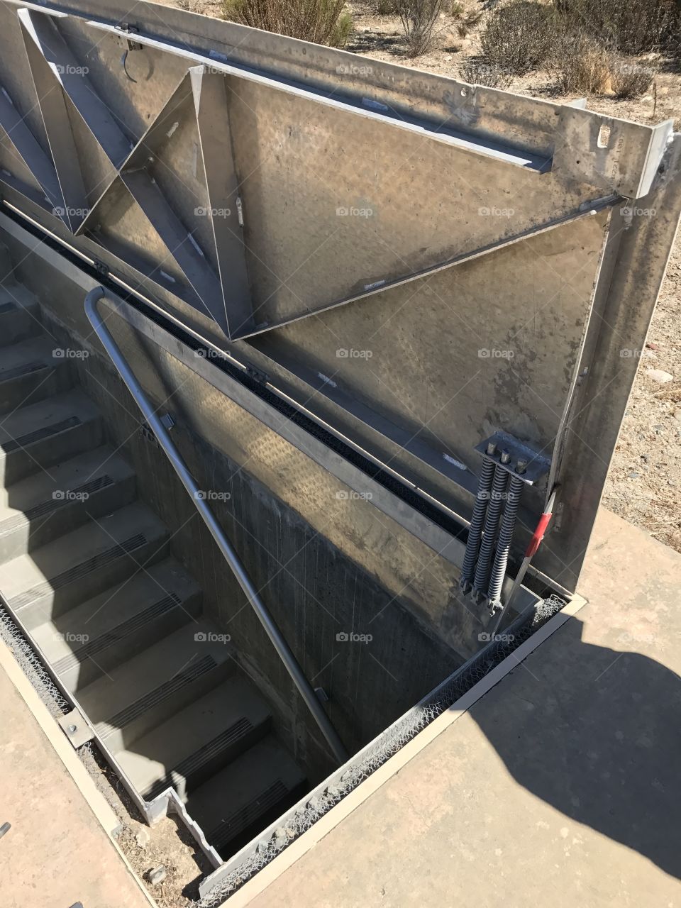 Metal staircase in the dirt ground