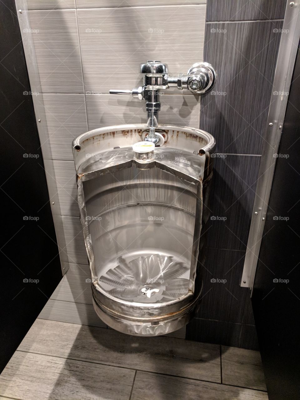 keg urinal bathroom at restaurant elixer