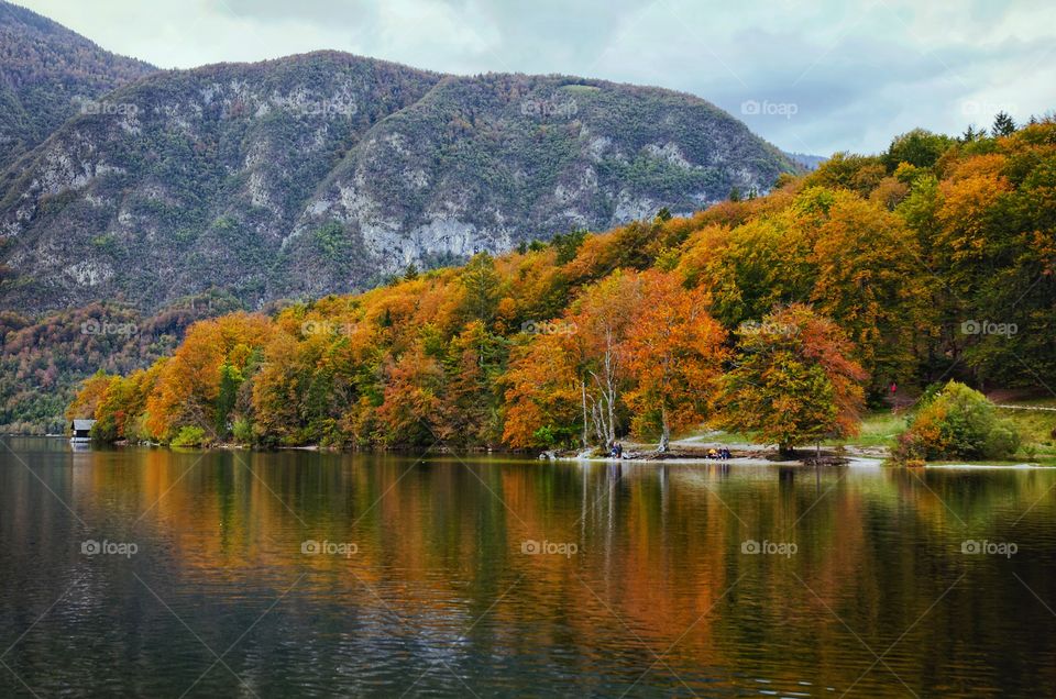 Background of the autumn mountains landscape against the lake Bohinj in Slovenia.