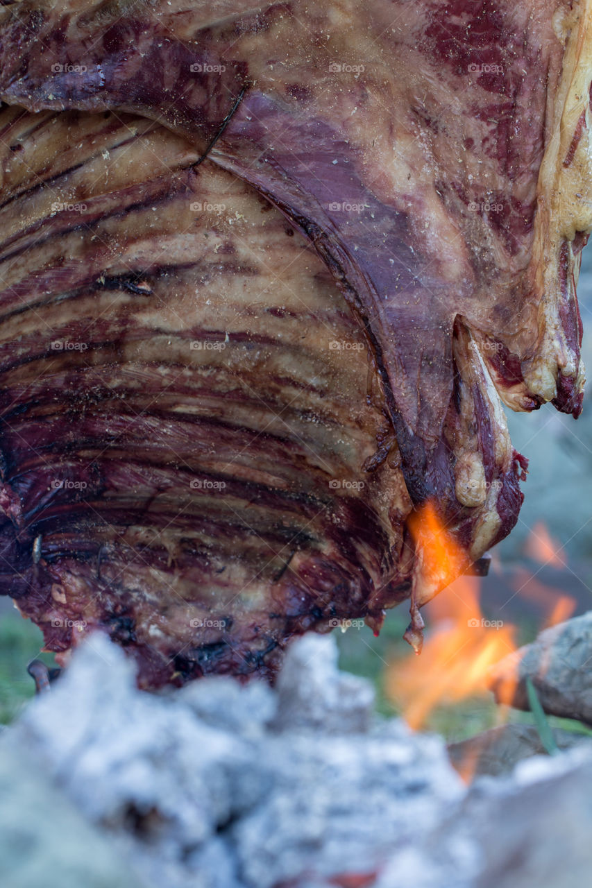 roast meat at flame