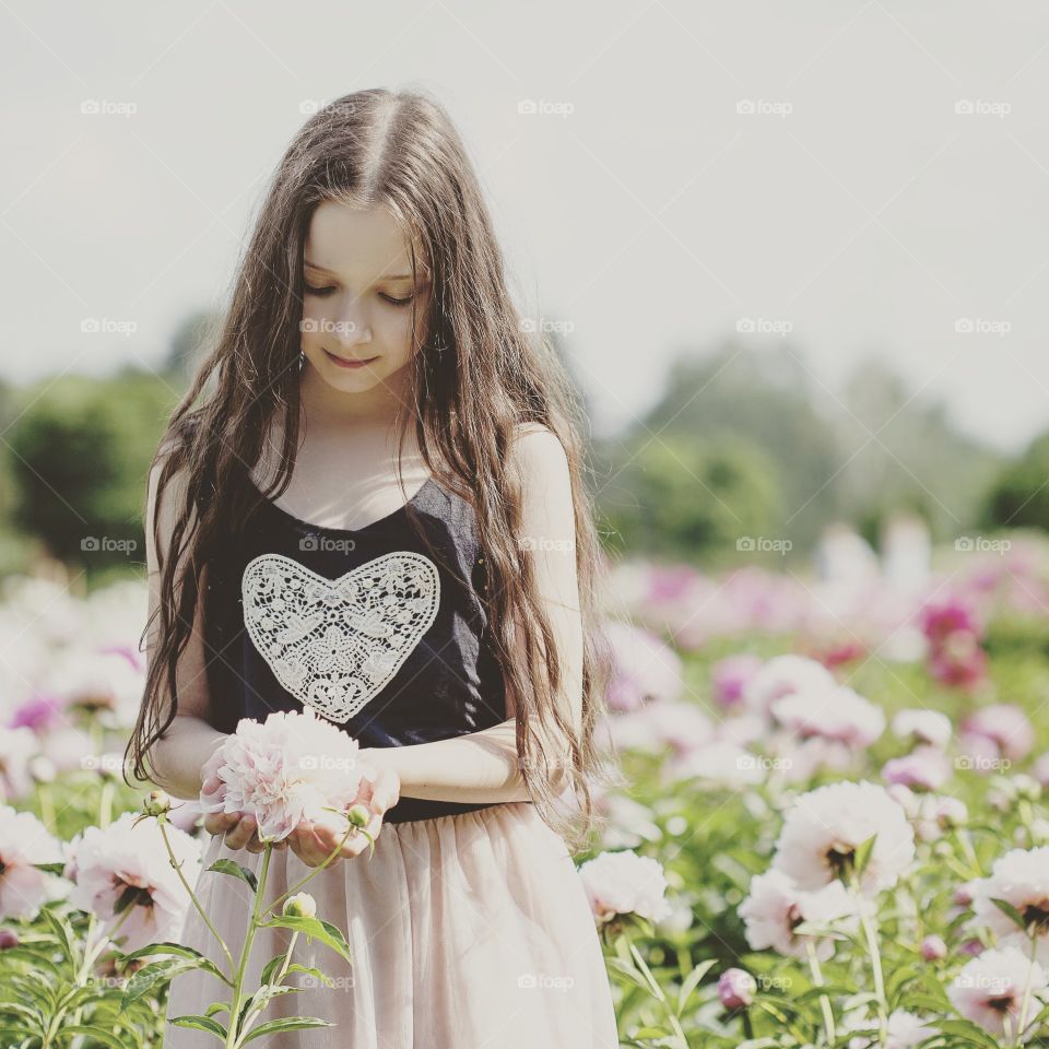 spring flowers,a girl in a field of peonies