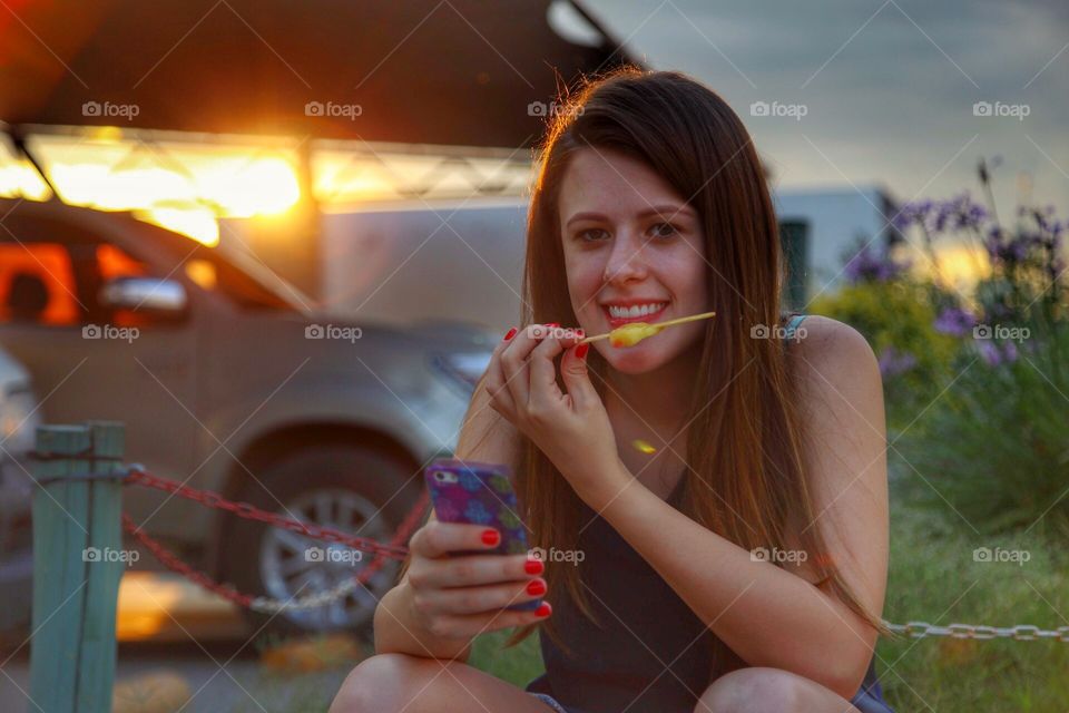 a beautiful girl eating ice cream