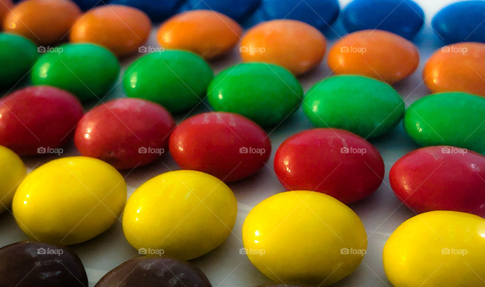 Lines of colourful m&ms