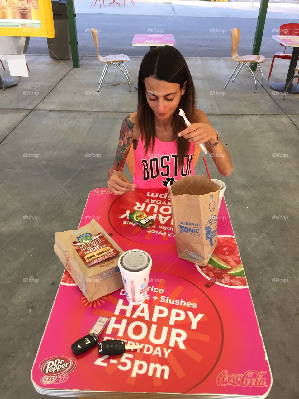 A hungry Woman ready to eat out from a famous american fast food