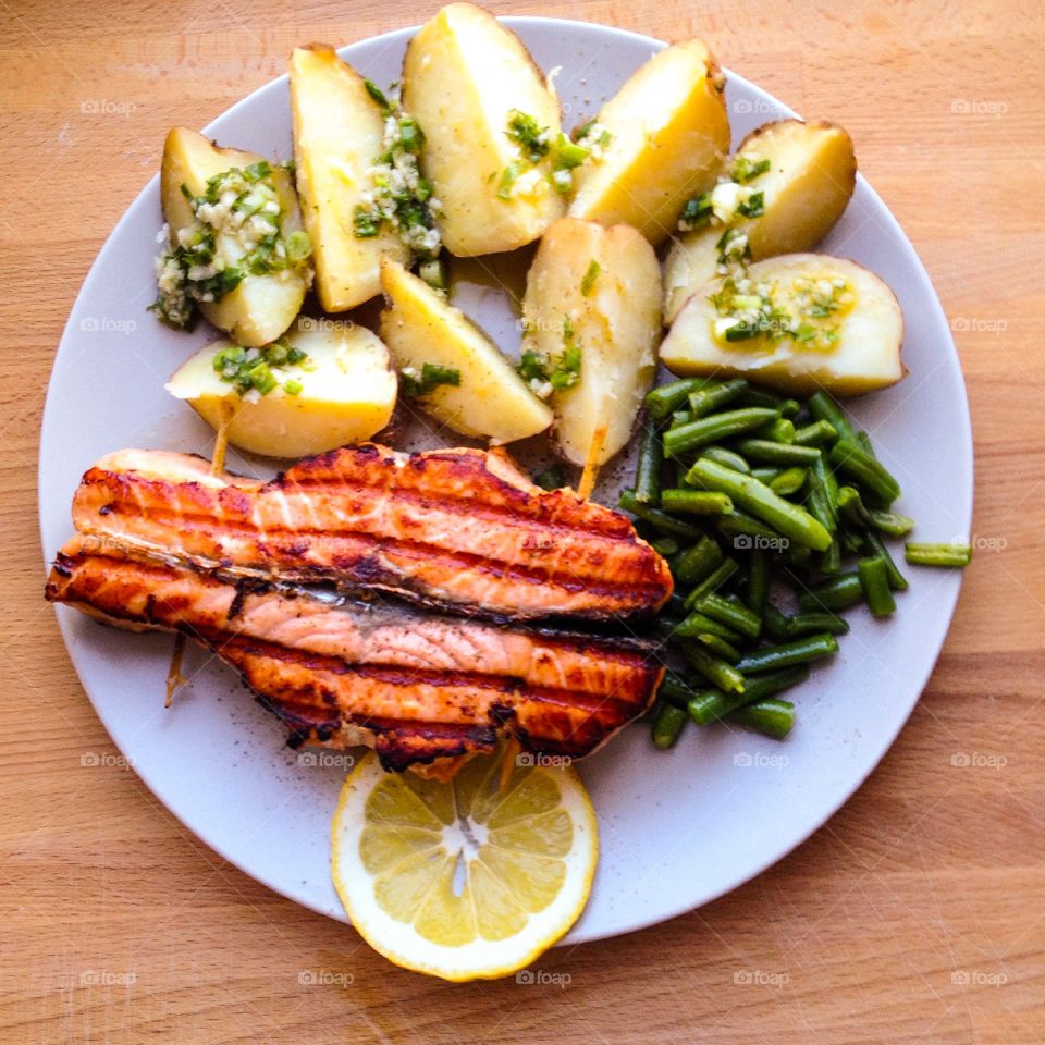 Red fish. A dinner with red fish, potato and French bean