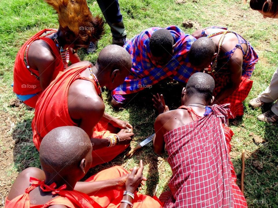 Maasai men making fire
