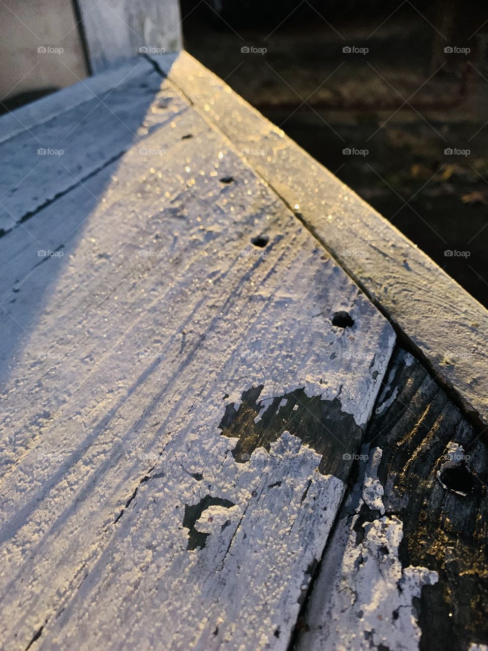 A glimpse at frost on a piece of wood. The paint is chipped, but what great texture. 
