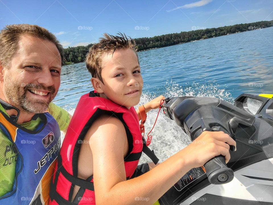 Father and son on the lake