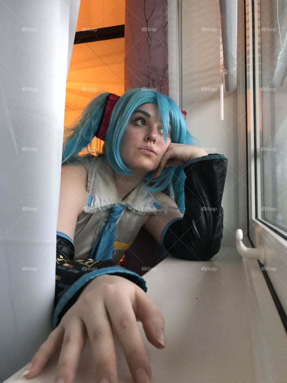 Hatsune Miku looking out the window.