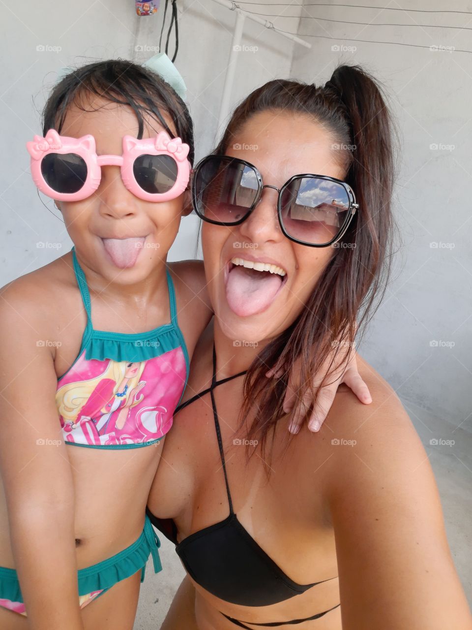 My family grimacing with their tongue