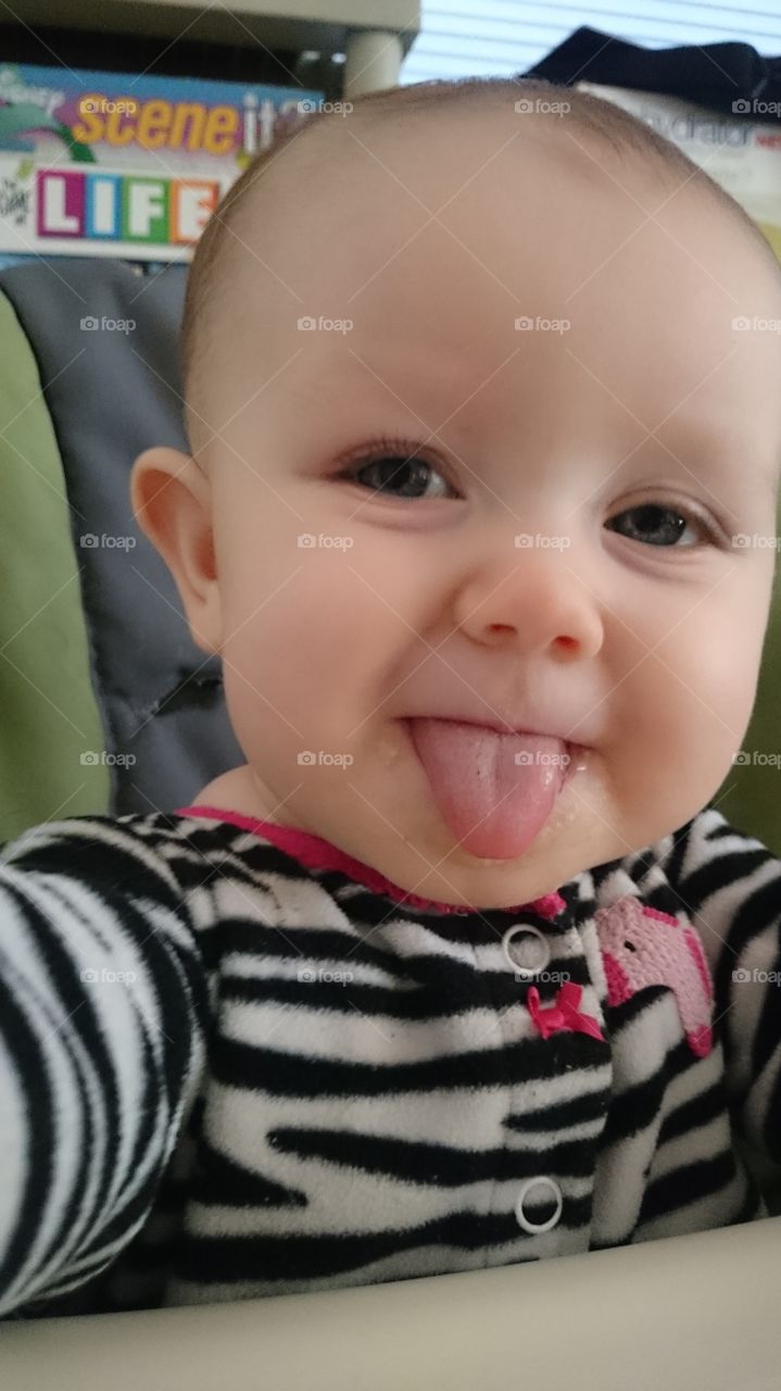 Baby sticking tongue out