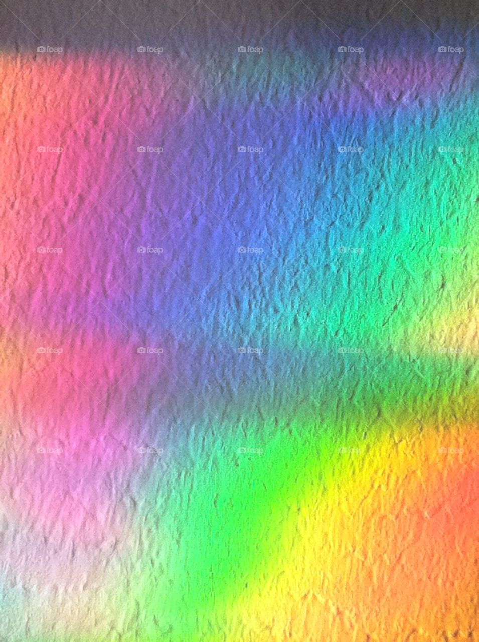 Rainbow reflection on wall