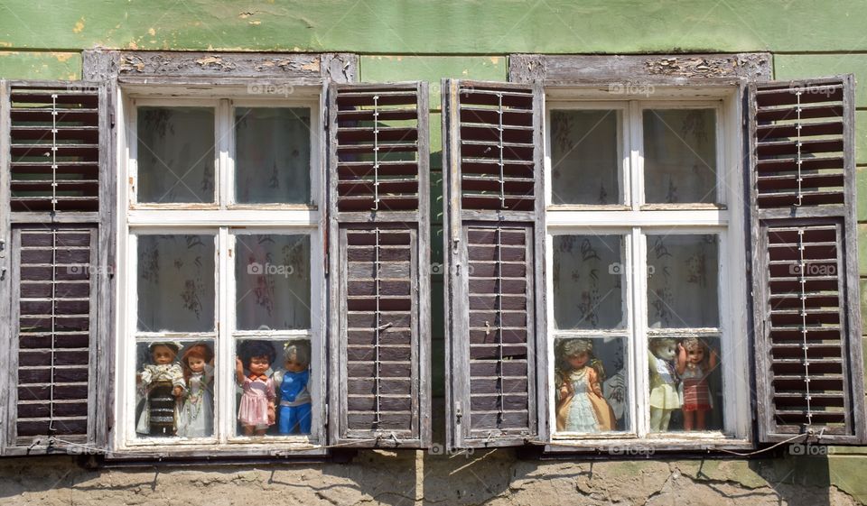 Window with old dolls