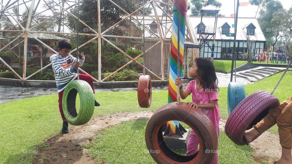 a children's game in the form of a tire that is played with a long rope on it is available in the city of Purbalingga, Indonesia
