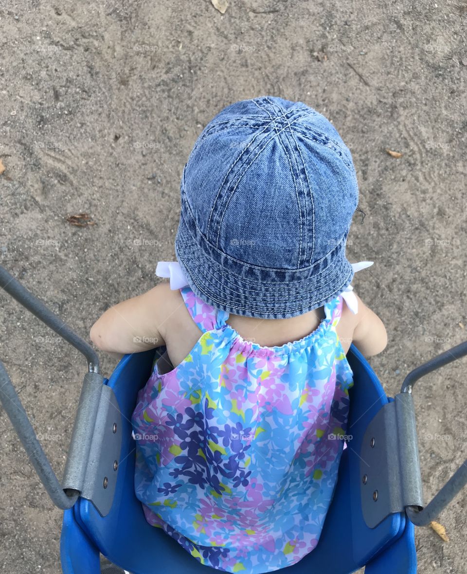 Baby girl on a swing