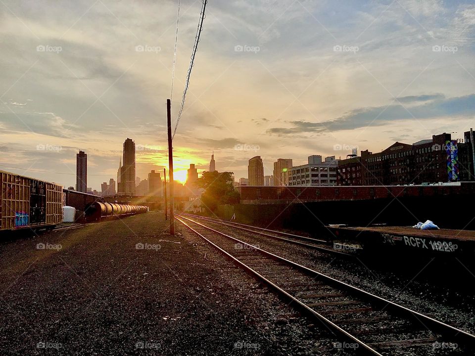 The train tracks by the Pulaski Bridge run parallel to Borden Ave in Long Island City, Queens, NY. We cross them every time we go ashore for anything such as shopping, doing laundry et cetera. 2022. Hypnotic Productions