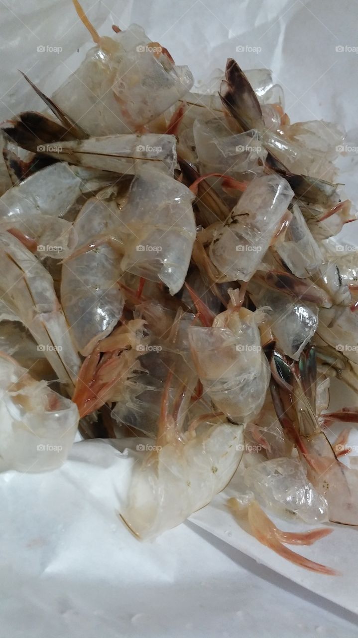 The shells of peeled shrimp.
