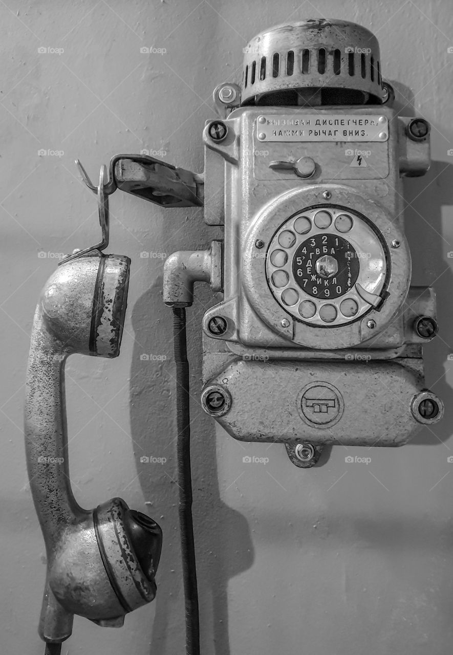 Monochrome photography old wall retro phone. Retro communication