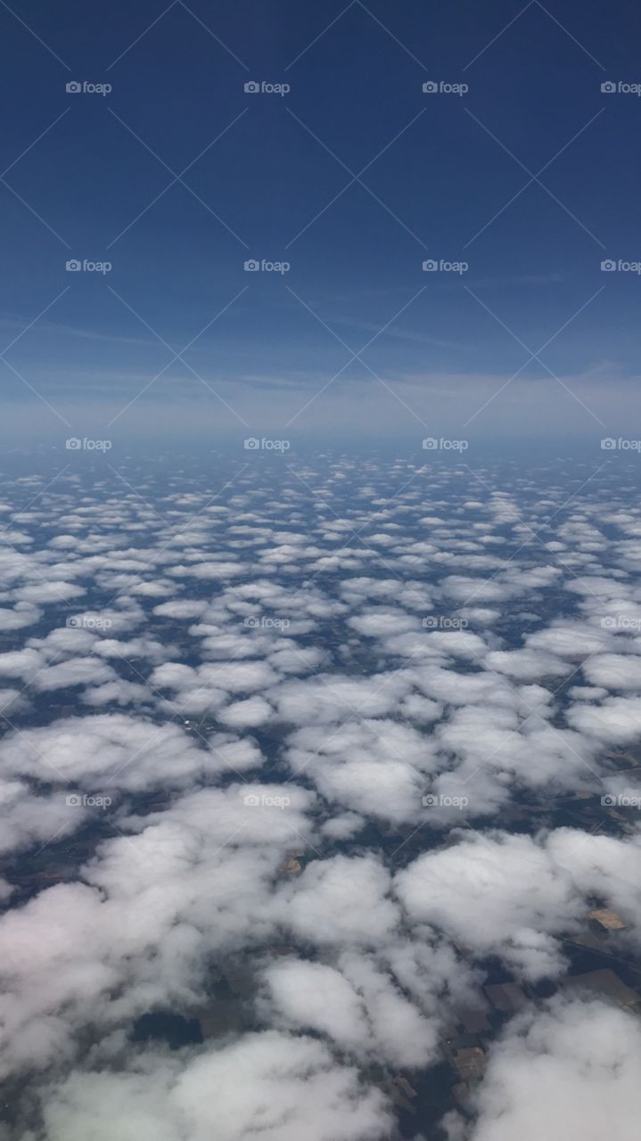 Clouds and blue skies from an airplane