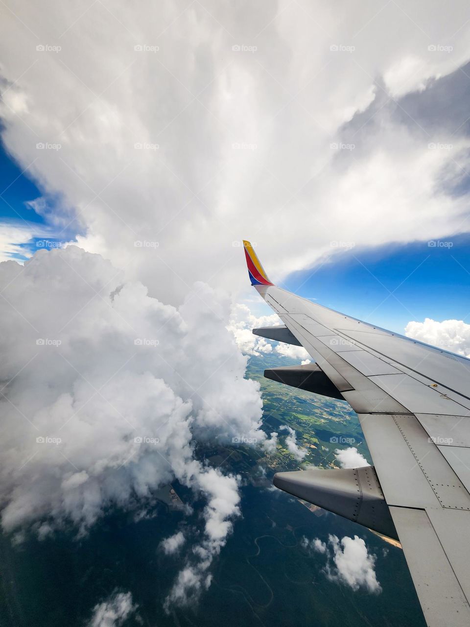 A Southwest Airlines 737 maneuvers around a massive cloud structure which could potentially damage a aircraft that flies through it