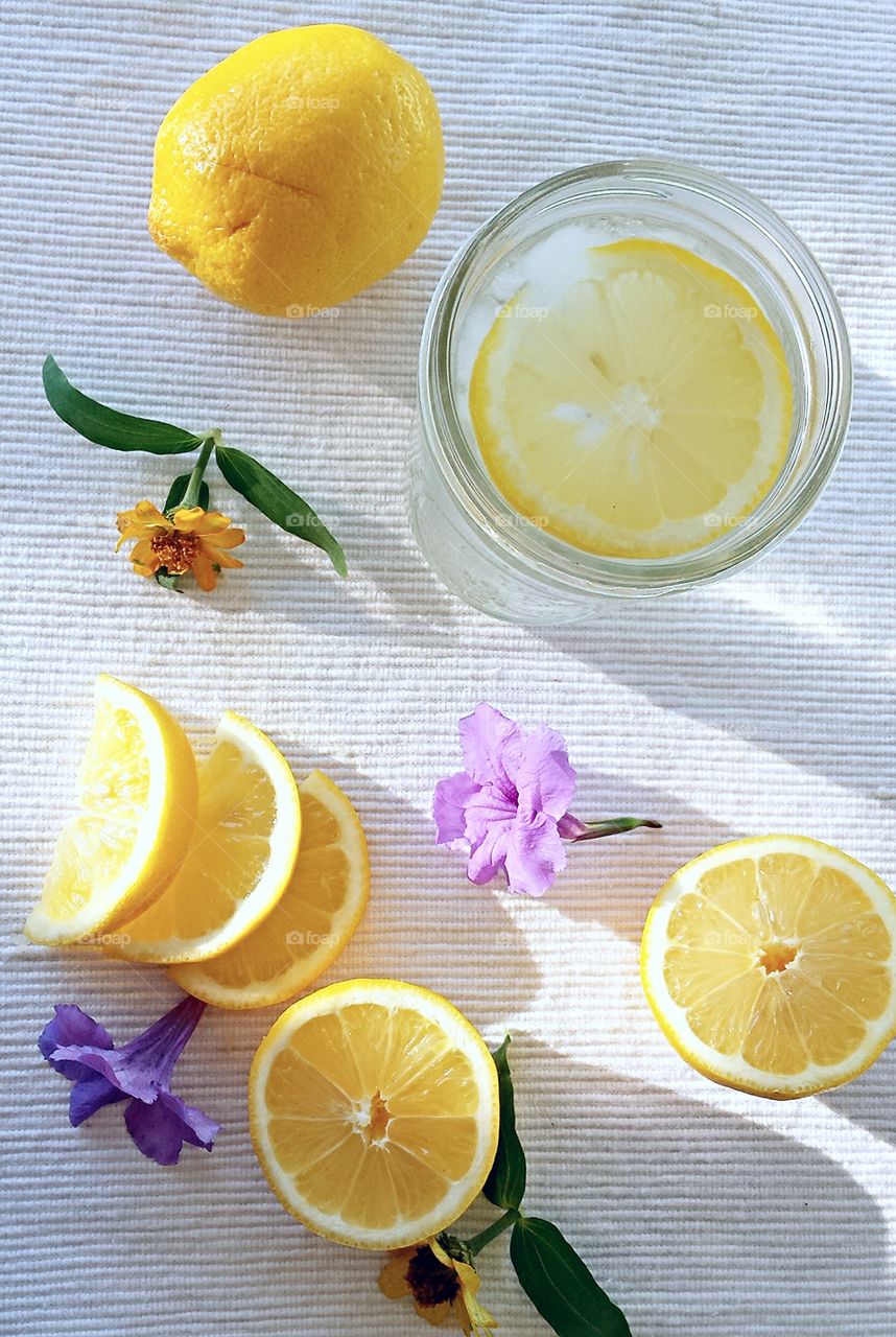 Lemonade and flowers flat lay