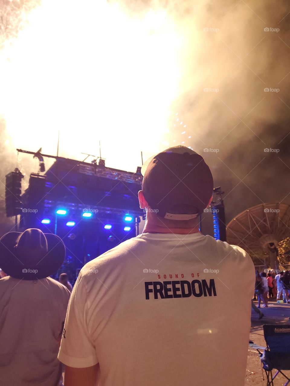 Independence day fireworks show celebration so bright it lights up the otherwise dark outdoors.