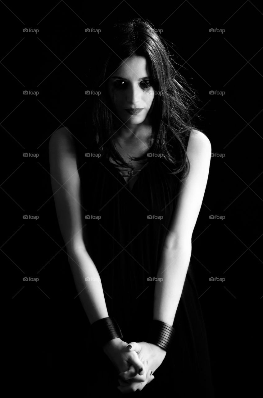 Woman in front of black background