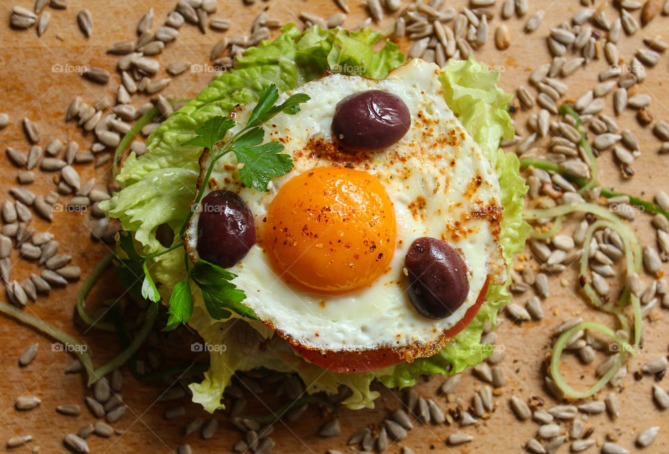 Burger with lettuce and fried egg
