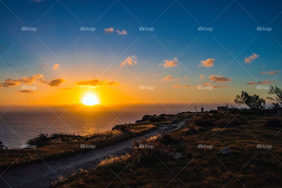 Sunset over the Mediterranean Sea, off the cliffs of Gozo. 