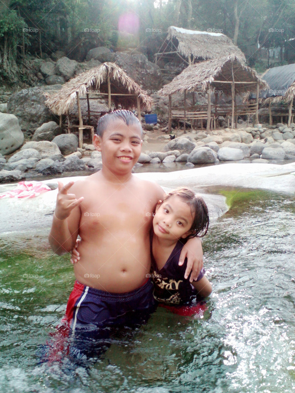 my brother and sister swimming .