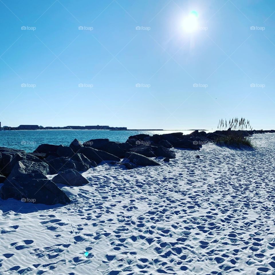 Jetties Destin east pass Florida rocks ocean water grass emerald coast blue green turquoise white sand