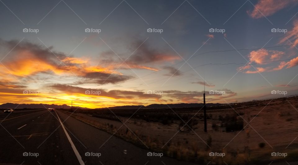 desert sky cloud road power lines