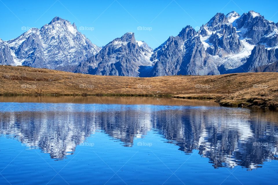 Beautiful reflection of Caucasus mountain in Koruldi lake at Georgia new landmark for tourists 